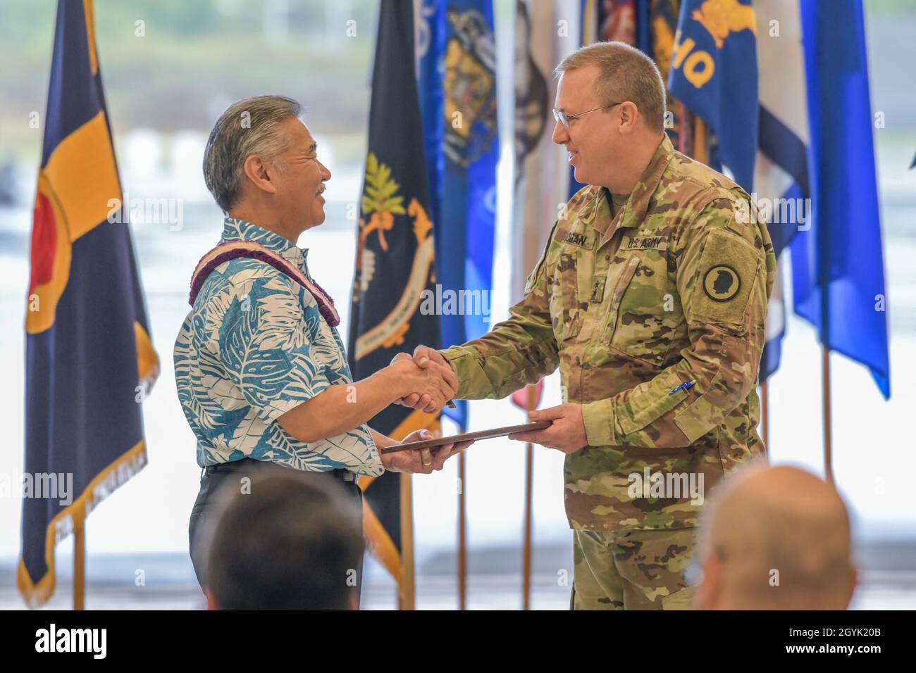 Hawaii State Governor, David Y. Ige, hands Maj. Gen. Arthur J. Logan, former Adjutant General of Hawaii a Certificate of Appreciation during his retirement ceremony at the 29th Infantry Brigade Combat Team Readiness Center, Kapolei, Hawaii, January 12, 2020. Stock Photo