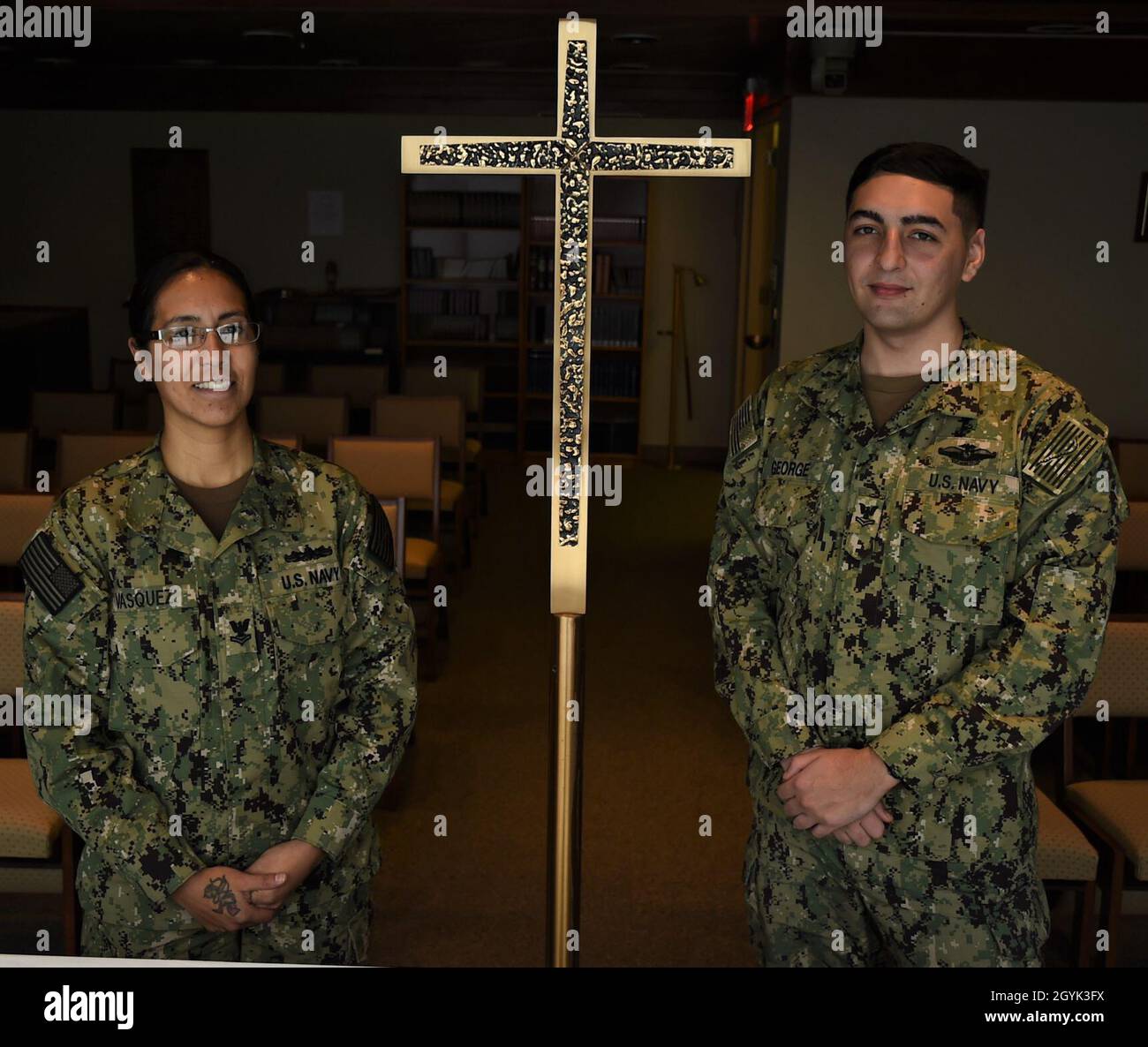 200113-N-XT693-001 NAVAL HOSPITAL BREMERTON, Wash. (Jan. 13, 2020) Religious Program Specialists (RP) 2nd Class Christopher George (right) and Pricilla Vasquez take a pause in the chapel at Naval Hospital Bremerton (NHB). As part of the command's Pastoral Care Department, both RP’s help to prepare devotional materials, organize faith-based events, maintain religious records, and serve as a source of personal security for the Navy Chaplain Corps. NHB supports more than 60,000 military families in West Puget Sound, shaping military medicine through training, mentoring and research to ensure a re Stock Photo