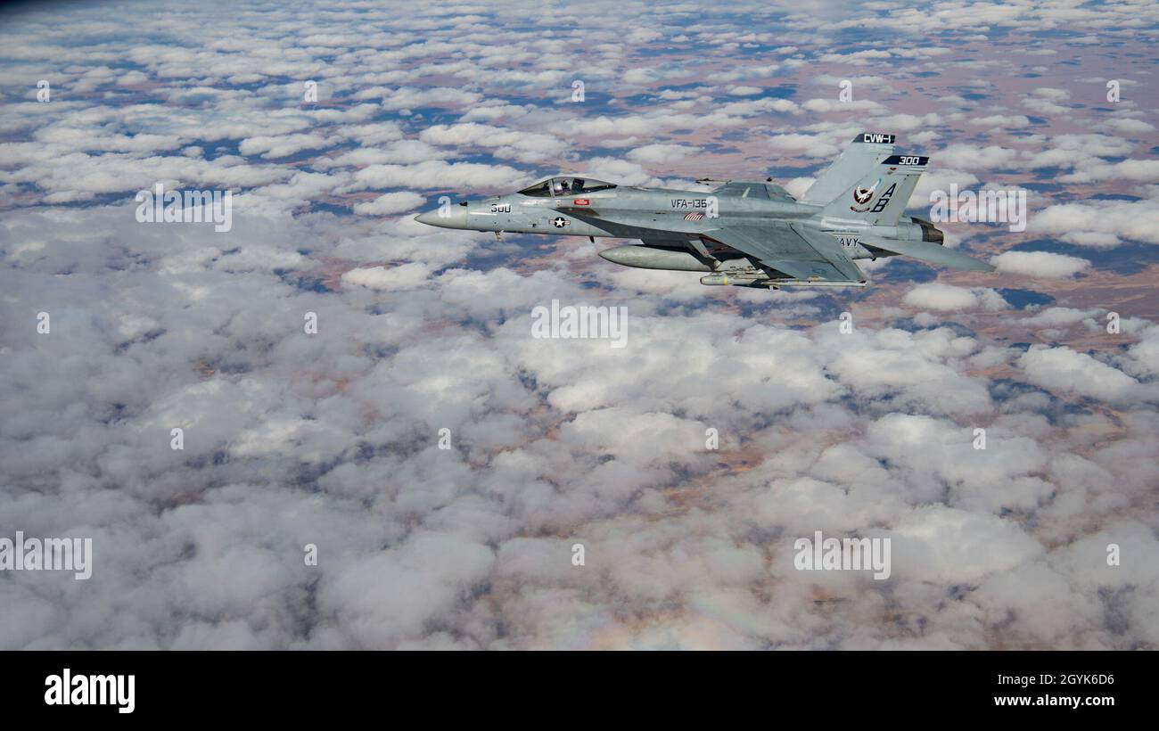 A U.S. Navy F/A-18 Super Hornet flies over Afghanistan, Jan. 14, 2020. U.S. Air Forces Central Command, conducts operations to deter adversaries and demonstrate support for allies and partners in the region. (U.S. Air Force photo by Staff Sgt. Bethany E. La Ville) Stock Photo