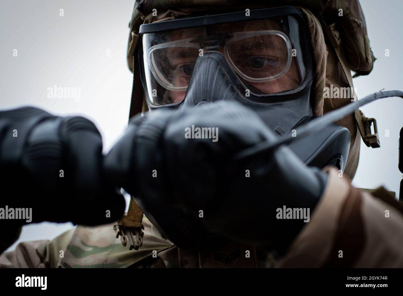 An Airman assigned to the 3d Weather Squadron connects wires from a