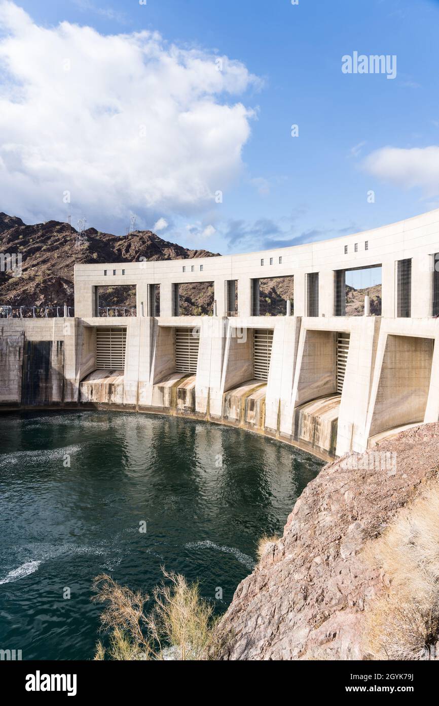 Parker Dam is a concrete arch-gravity dam built on the Colorado River in 1938 & impounds Lake Havasu between Arizona & California. Stock Photo