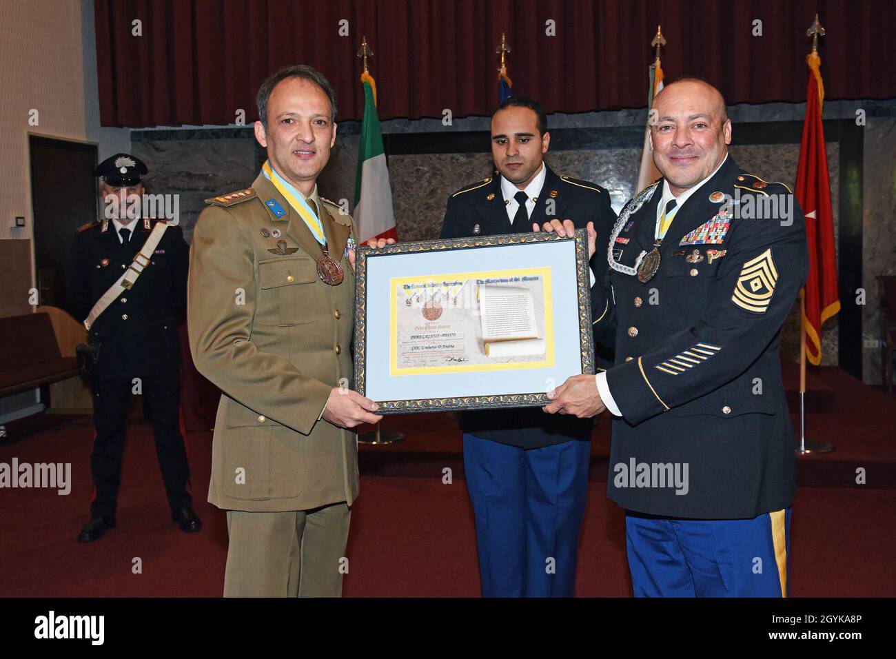U.S. Army Soldier Master Sgt. Melvyn Lopez, right, presents the National Infantry Association “The Martyrdom of Saint Maurice” Medal to the outgoing Deputy Chief of Staff of United States Army Africa and Senior Italian Officer Colonel Umberto D’Andria, during the Designation of Responsibility Ceremony at Caserma C. Ederle in Vicenza, Italy, January 16, 2020. (U.S. Army Photos by Paolo Bovo) Stock Photo