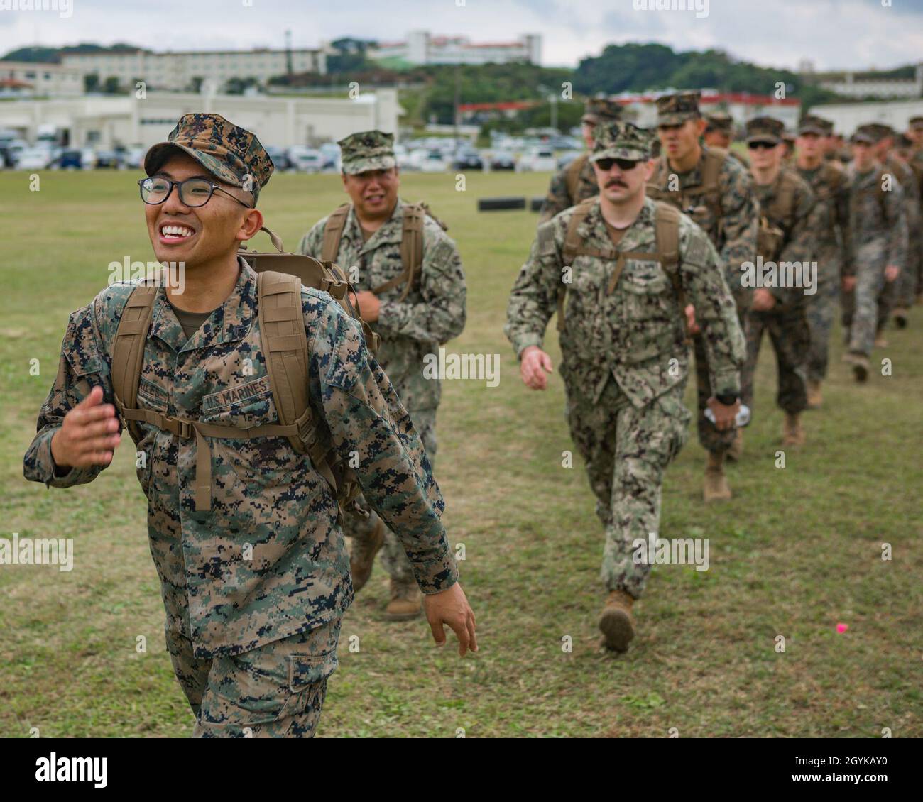 U.S. Marine Corps Cpl. Christian Hago, a network administrator with Headquarters and Support Battalion, Marine Corps Installations Pacific, participates in a hike in honor of Martin Luther King Jr. hike around Camp Foster, Okinawa, Japan on Jan. 16, 2019. The purpose of the hike was to commemorate Dr. King's life and his struggle to combat racial inequality through nonviolent resistance and civil disobedience. (U.S. Marine Corps photo by Cpl. Christopher A. Madero) Stock Photo