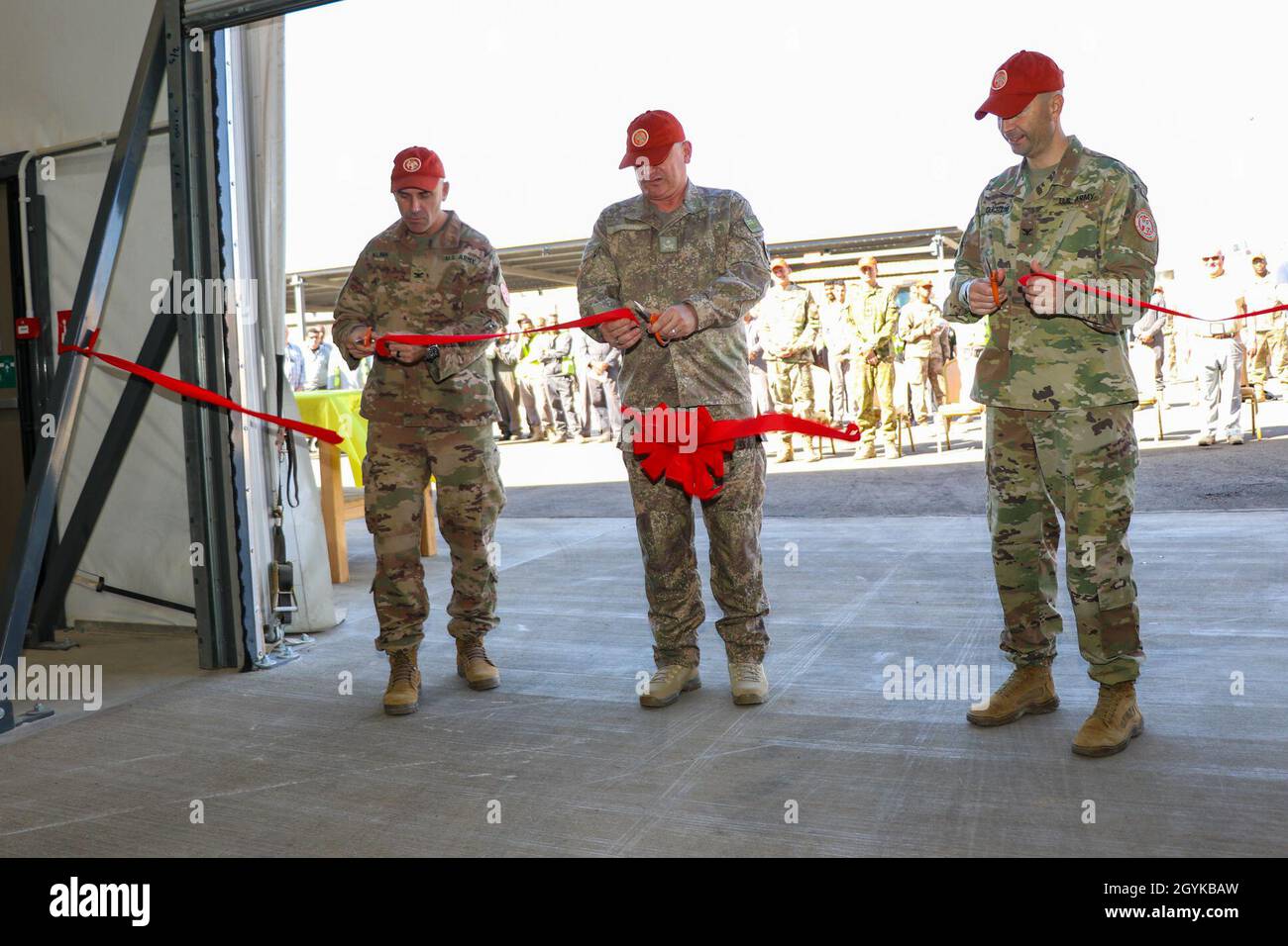 Col. Brandon Klink, left, deputy commander of Task Force Sinai, Maj. Gen. Evan Williams, center, force commander of the Multinational Force and Observers, and Col. Robert Duchaine, commander of Task Force Sinai and the chief of staff for the MFO, cut the ribbon entering the new Supply Support Activity facility on South Camp, Egypt, Jan. 16, 2020. The new facility is essential to the controlled receiving, distribution, issuing and storage of stocked parts supporting the Multinational Force and Observers mission.(U.S. Army photo by Staff Sgt. Eliverto V. Larios) Stock Photo