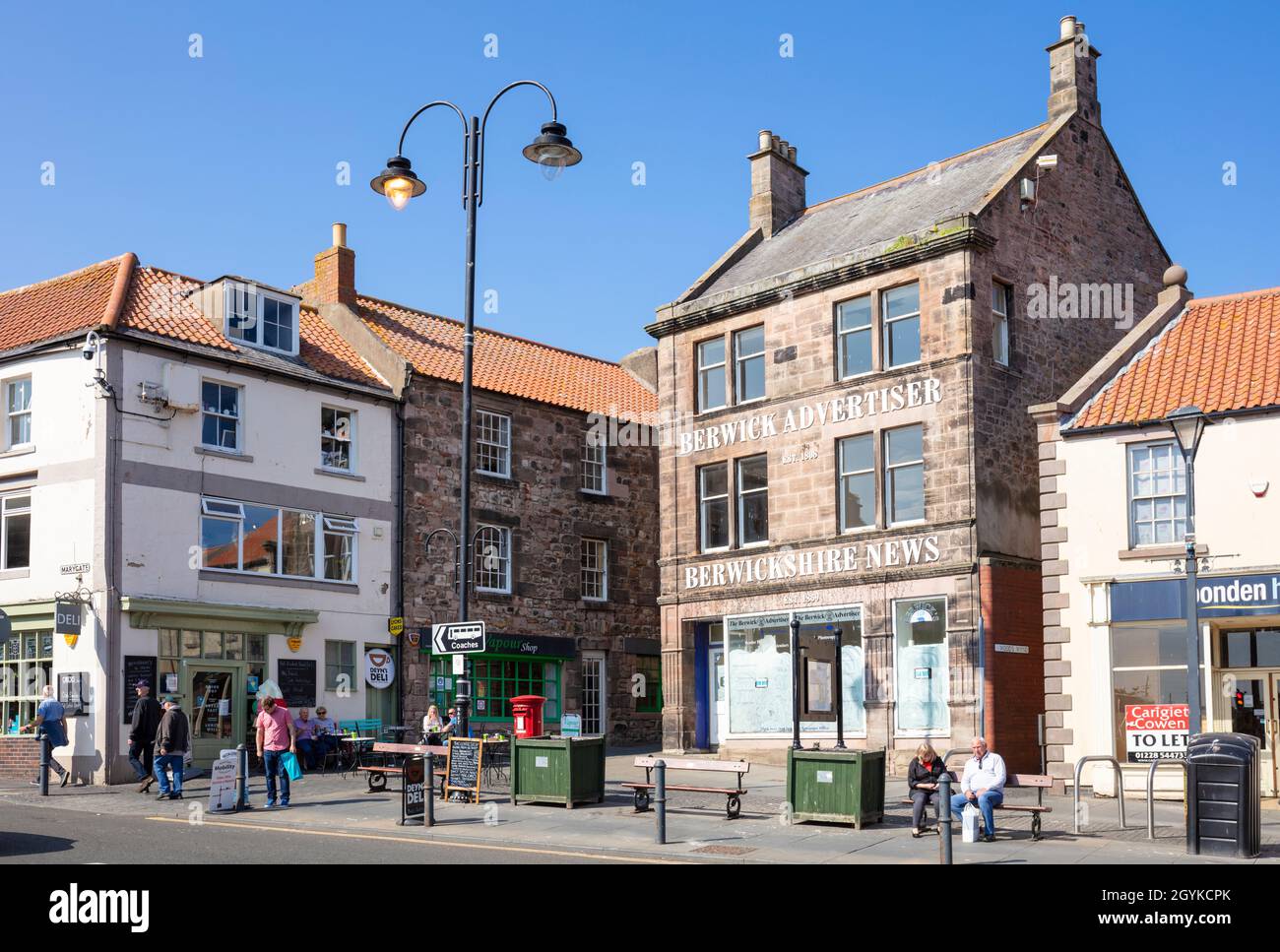 Shops and businesses and the old Berwick Advertiser building on Marygate in Berwick-upon-Tweed or Berwick-on-Tweed Northumberland England GB UK Europe Stock Photo