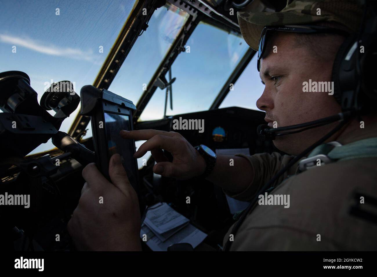 U.S. Air Force Capt. Bryan Reed, a 746th Expeditionary Airlift Squadron C-130 Hercules pilot, looks at a map over Saudi Arabia, Jan. 16, 2020. The flexible design of the C-130 enables it to be configured for multiple different missions, allowing one aircraft to perform the role of many and project premier airlift airpower in the U.S. Central Command area of responsibility. (U.S. Air Force photo by Staff Sgt. Matthew Lotz) Stock Photo