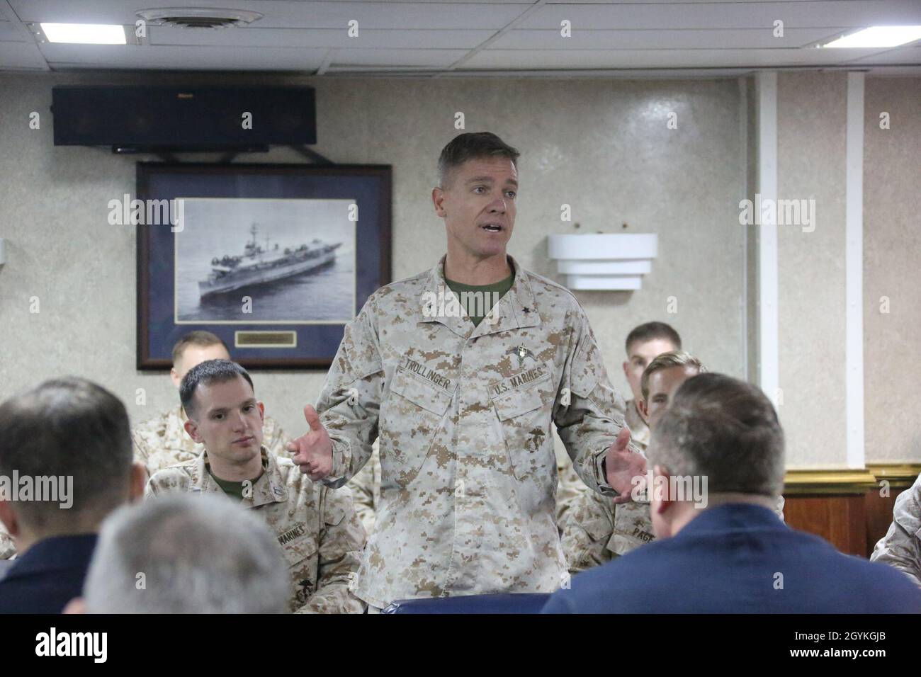 200118-M-OO419-1010 RED SEA (Jan. 18, 2020) Brig. Gen. Matthew Trollinger, commanding general of Task Force 51/5th Marine Expeditionary Brigade, speaks to Navy and Marine Corps officers aboard the amphibious assault ship USS Bataan (LHD 5). Bataan Amphibious Ready Group, with embarked 26th MEU, is deployed to the U.S. 5th Fleet area of operations in support of maritime security operations to reassure allies and partners and preserve the freedom of navigation and the free flow of commerce in the region. (U.S. Marine Corps photo by Cpl. Nathan Reyes) Stock Photo