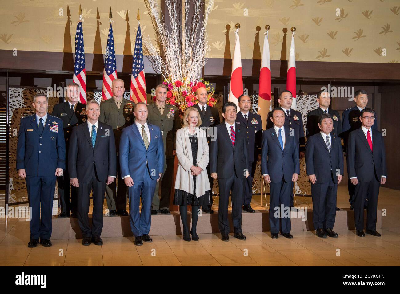 TOKYO, Japan – Japanese Prime Minister Shinzo Abe, center right, stands alongside Mary Jean Eisenhower, center left, and senior official and military leaders of U.S. and Japan at a reception ceremony commemorating the 60th anniversary of the U.S-Japan Treaty of Mutual Cooperation and Security. The treaty was signed by the governments of then U.S. President Dwight D. Eisenhower, grandfather to Mary Jean Eisenhower, and then Japanese Prime Minister Nobusuke Kishi, grandfather of current Prime Minister Shinzo Abe. (U.S. Navy photo by Mass Communication Specialist 2nd Class Jeanette Mullinax) Stock Photo