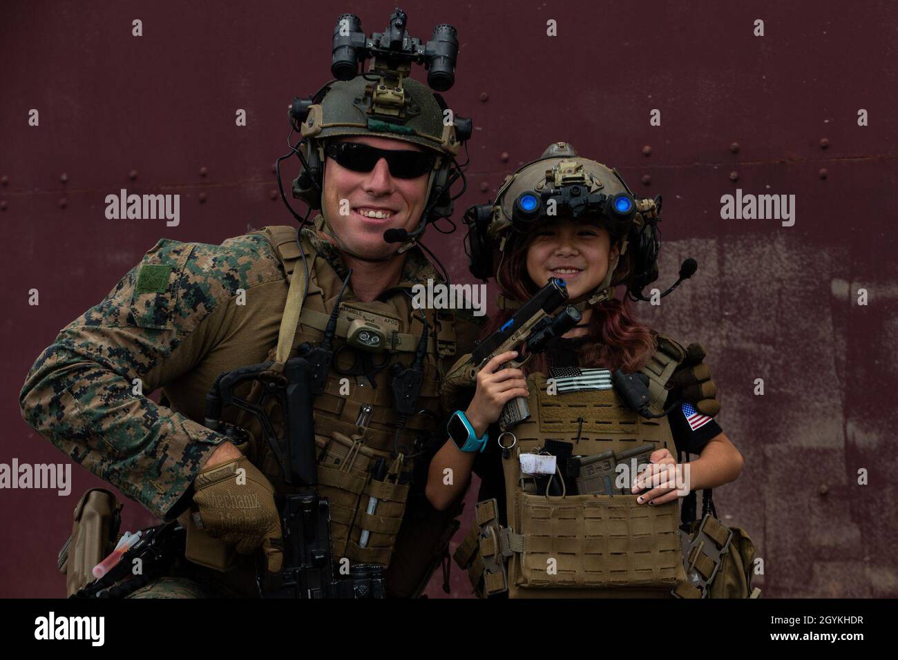 A Force Reconnaissance Marine with the 31st Marine Expeditionary Unit’s Maritime Raid Force poses for a photo with a child during a community interaction, tactical demonstration event in Kapolei, HI, Jan. 19, 2020. The 31st MEU, the Marine Corps’ only continuously forward-deployed MEU, provides a flexible and lethal force ready to perform a wide range of military operations as the premier crisis response force in the Indo-Pacific region. (Official U.S. Marine Corps photo by Cpl. Isaac Cantrell) Stock Photo