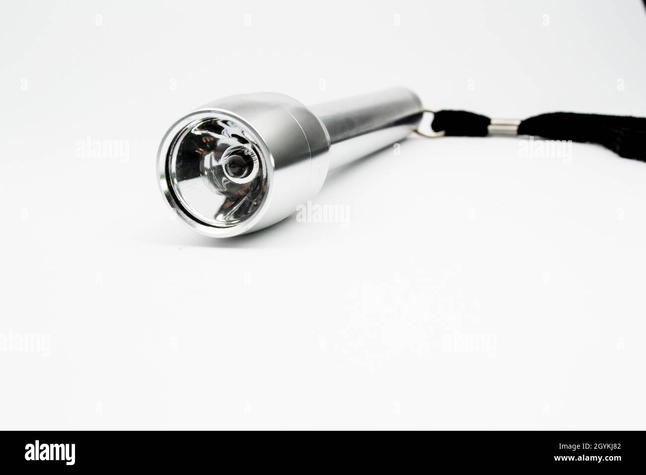 silver flashlight with isolated empty background Stock Photo