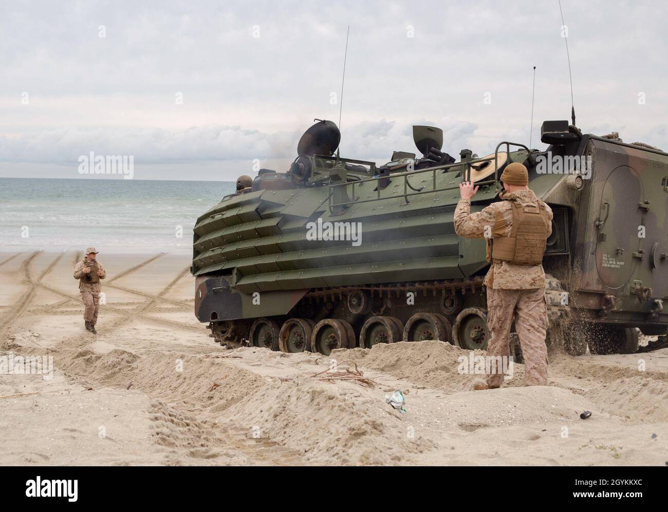 U.S. Marine Corps Cpl. Alexander Pritchard, left, a crew chief, and Cpl. Tyler Brenot, an assault amphibious vehicle crewmember, both with 3rd Assault Amphibian Battalion, ground guide an AAV-P7/A1 assault amphibious vehicle in preparation for section-level beach landing training during Exercise Iron Fist 2020 on Marine Corps Base Camp Pendleton, California, Jan. 20. Exercises like Iron Fist enhance the Marine Corps ability to quickly deploy sea-based assets and provide military forces anywhere in the world. (U.S. Marine Corps photo by Sgt. Desiree King) Stock Photo