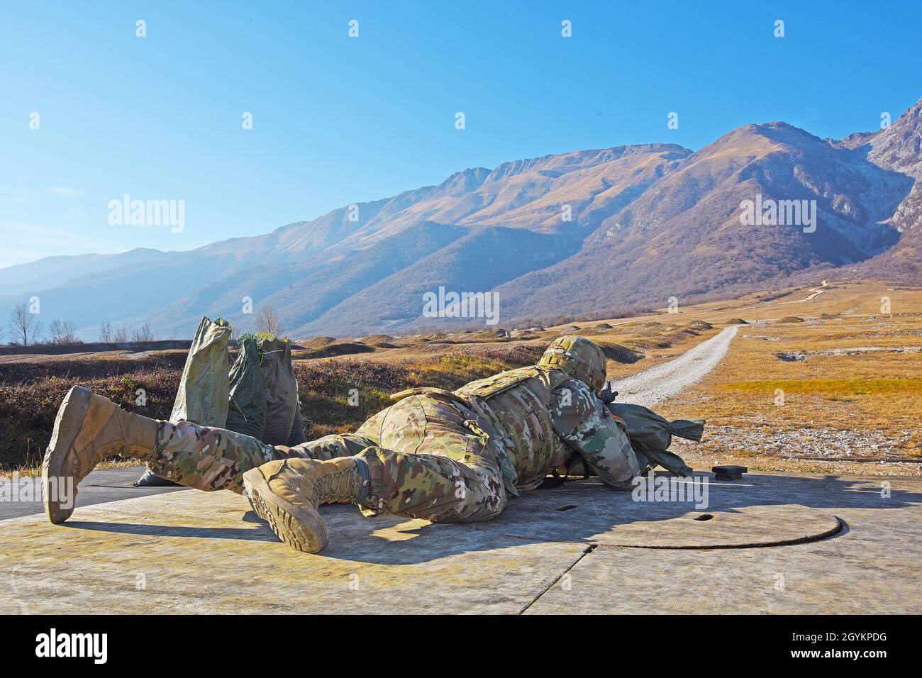 A U.S. Army Paratrooper assigned to the 173rd Airborne Brigade engages targets with an M4 carbine in prone position during weapons qualification at Cao Malnisio Range, Pordenone, Italy, Jan. 22, 2020. The 173rd Airborne Brigade is the U.S. Army Contingency Response Force in Europe, capable of projecting ready forces anywhere in the U.S. European, Africa or Central Commands' areas of responsibility. (U.S. Army photo by Paolo Bovo) Stock Photo