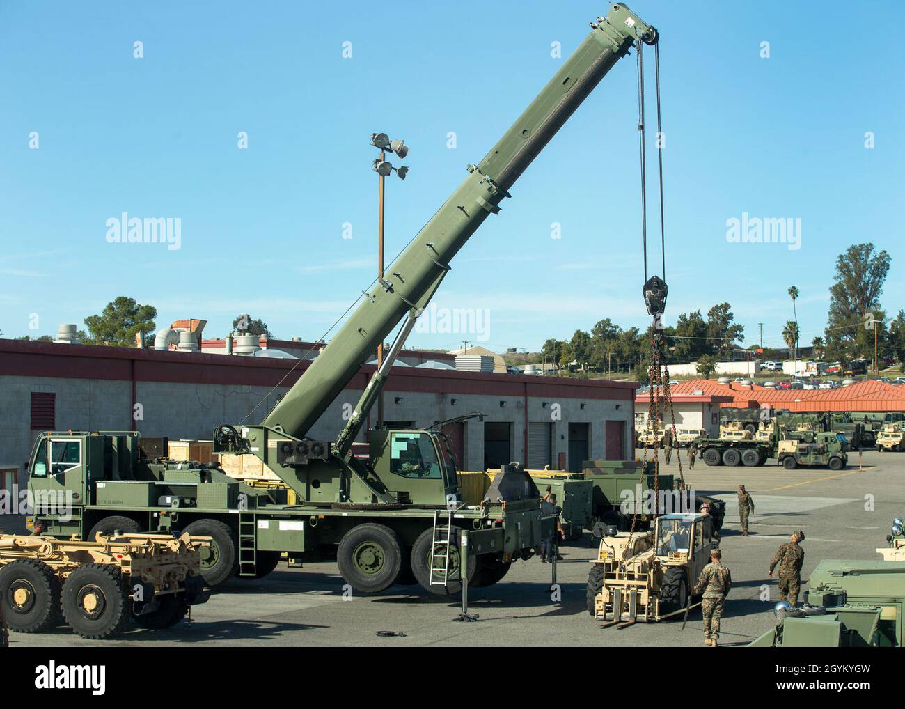 A U.S. Military All-Terrain Crane (MAC-50) belonging to 1st Transportation Support Battalion, 1st Marine Logistics Group, at lifts a forklift for the testing of a 3D-printed sheave at Marine Corps Base Camp Pendleton, California, Jan. 24, 2019. The test was part of an experiment to see if 3-dimentional printing can be a suitable form of manufacturing for supply-chain replacement. (U.S. Marine Corps photo by Cpl. L. Ruth Wheeley) Stock Photo