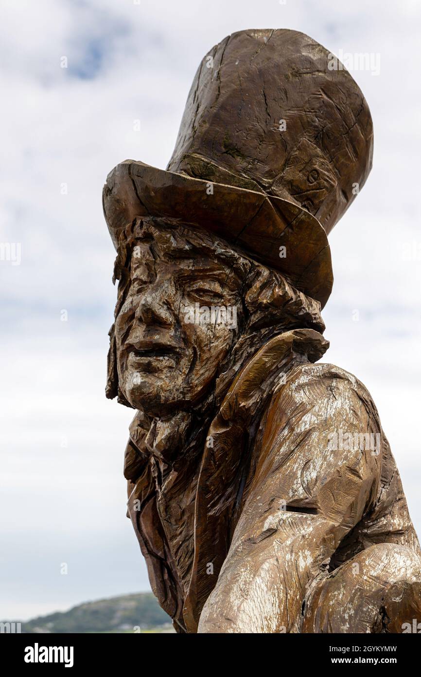 Mad Hatter wooden sculpture on Llandudno promenade in north Wales Stock Photo