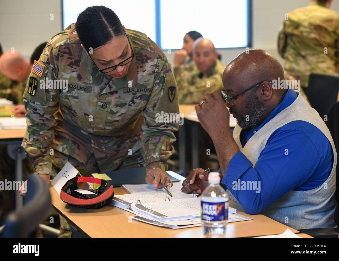 A u s army master resilience training course instructor helps a