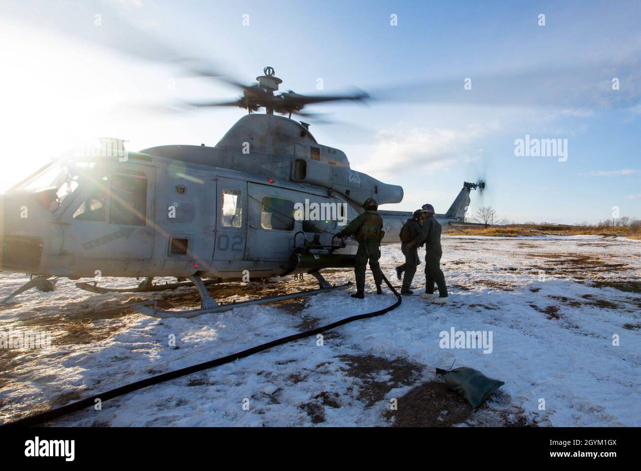 U.S. Marines from Marine Wing Support Squadron 172, Marine Air Control Group 36, 1st Marine Air Wing, refuel an UH-1Y helicopter attached to Marine Light Attack Helicopter Squadron 369 on a Forward Arming and Refueling Point (FARP) during exercise Northern Viper on Yausubetsu Training Area, Hokkaido, Japan, Jan. 25, 2020. FARPs give Marines the capability to rapidly re-arm munitions and refuel aircraft while forward deployed. Northern Viper is a regularly scheduled training exercise that is designed to enhance the collective defense capabilities of the U.S. and Japan Alliance by allowing infan Stock Photo