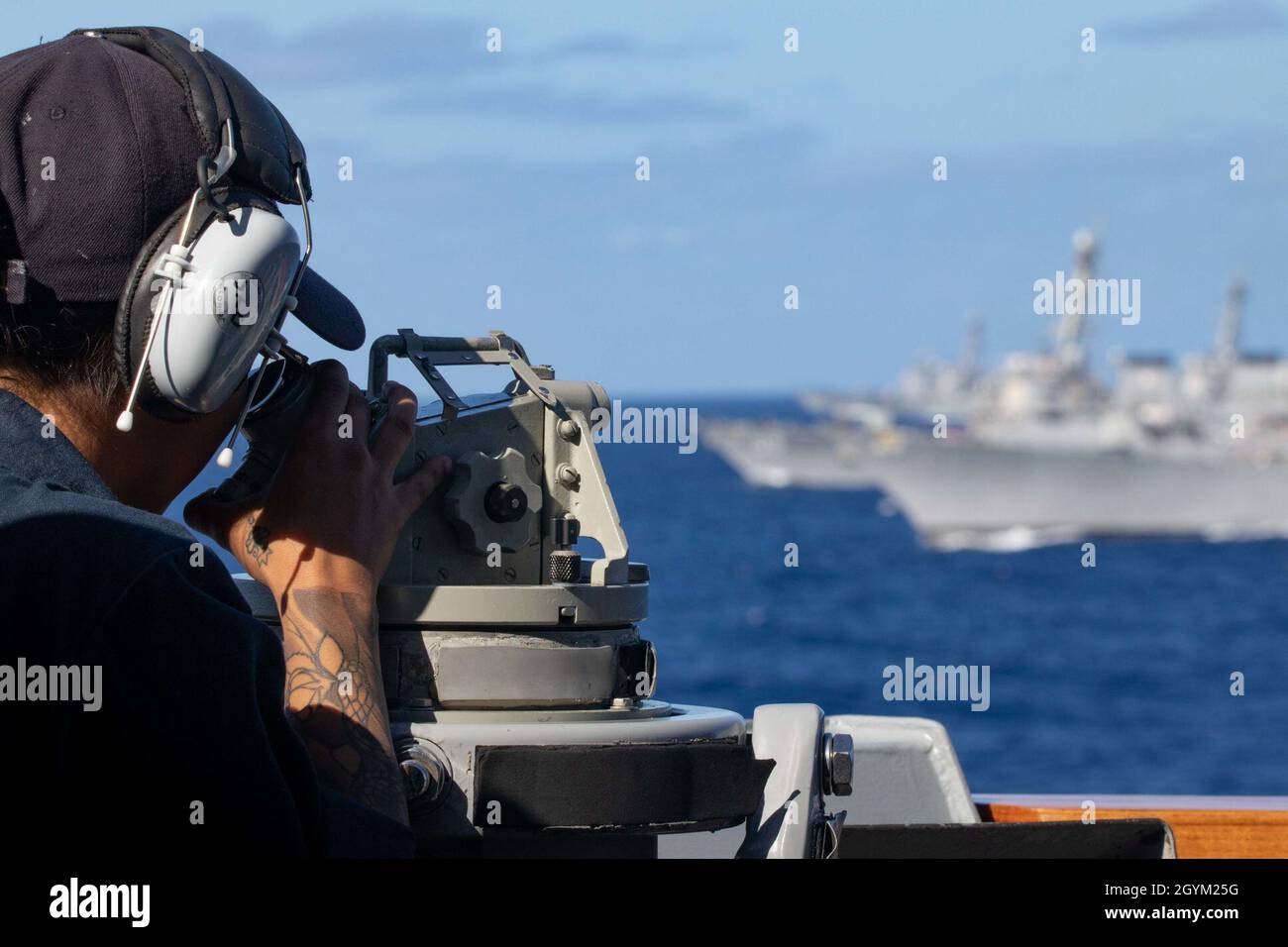 PACIFIC OCEAN (Jan. 25, 2020) Boatswain’s Mate 3rd Class Mariah Blondet, from Columbus, Ohio, uses a telescopic alidade aboard the Arleigh Burke-class guided-missile destroyer USS Pinckney (DDG 91) Jan. 25, 2020. Pinckney, part of the Theodore Roosevelt Carrier Strike Group, is on a scheduled deployment to the Indo-Pacific. (U.S. Navy photo by Mass Communication Specialist 3rd Class Erick A. Parsons) Stock Photo