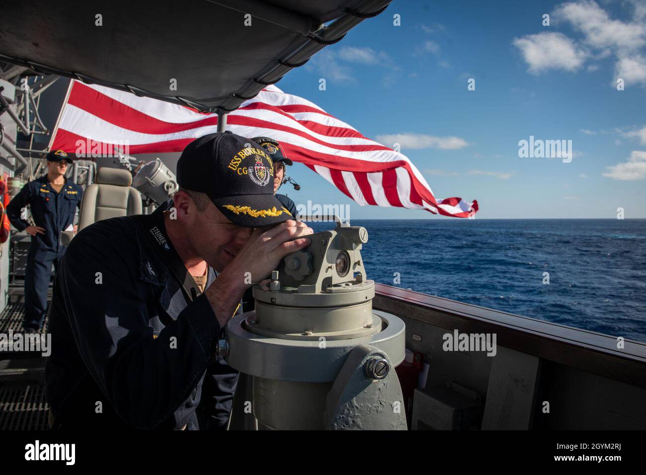 PACIFIC OCEAN (Jan. 25, 2020) Capt. Kurt Sellerburg, commanding officer of the Ticonderoga-class guided-missile cruiser USS Bunker Hill (CG 52), uses a telescopic alidade to take a bearing to a surface contact Jan. 25, 2020. Bunker Hill, part of the Theodore Roosevelt Carrier Strike Group, is on a scheduled deployment to the Indo-Pacific. (U.S. Navy photo by Mass Communication Specialist 3rd Class Nicholas V. Huynh) Stock Photo