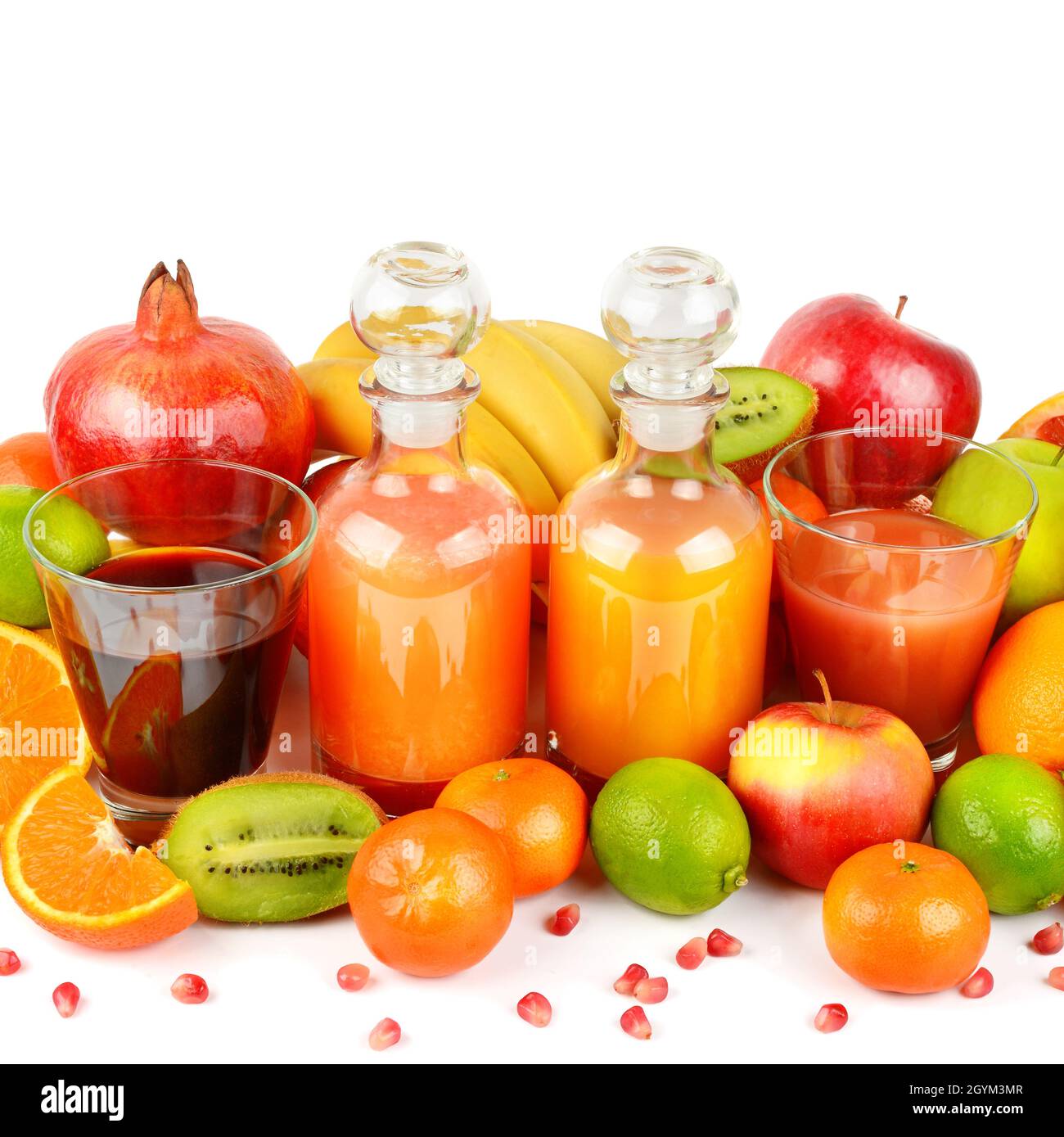 Isolated juices. Glasses of fresh juice and pile of tropical fruits  isolated on white background with clipping path Stock Photo - Alamy