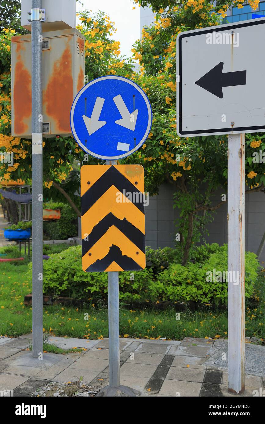 blue Traffic Signs “ Turn left and turn right “ and reflective strips