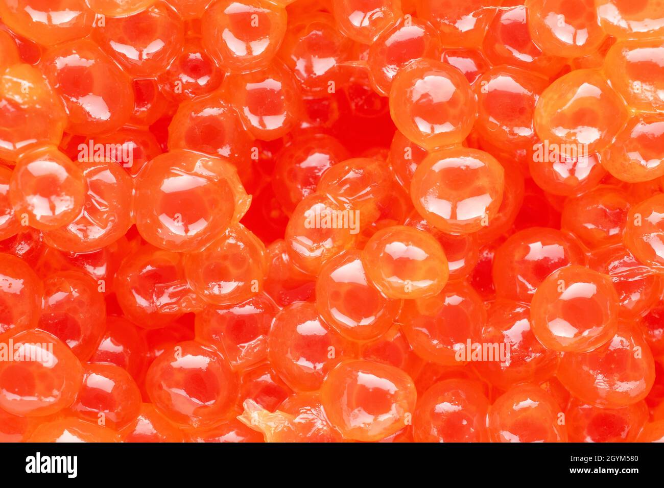Weakly salted red caviar of chum salmon, close-up, top view. Stock Photo
