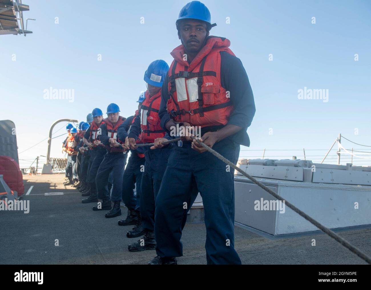 PACIFIC OCEAN (Jan. 27, 2020) Sailors aboard the Arleigh Burke-class guided-missile destroyer USS Paul Hamilton (DDG 60) heave a line during a replenishment-at-sea with the Military Sealift Command fast combat support ship USNS Arctic (T-AO 8) Jan. 27, 2020.  Paul Hamilton, part of the Theodore Roosevelt Carrier Strike Group, is on a scheduled deployment to the Indo-Pacific. (U.S. Navy photo by Mass Communication Specialist 3rd Class Matthew F. Jackson) Stock Photo