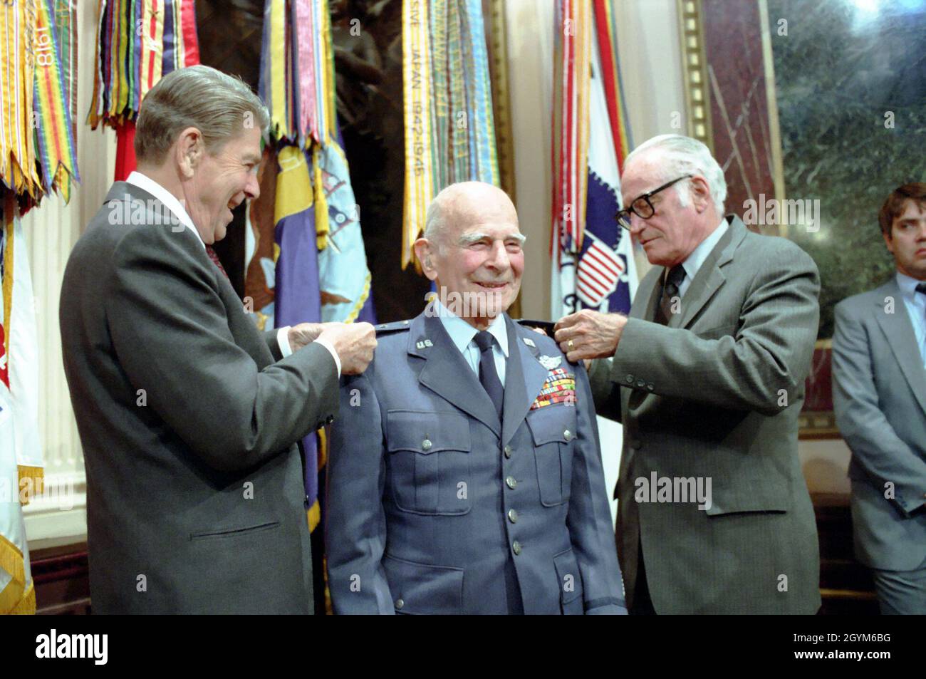 6/13/1985 President Reagan and Senator Barry Goldwater present the fourth star to General Jimmy James Doolittle during a ceremony in the Indian Treaty Room OEOB Room 474 Stock Photo