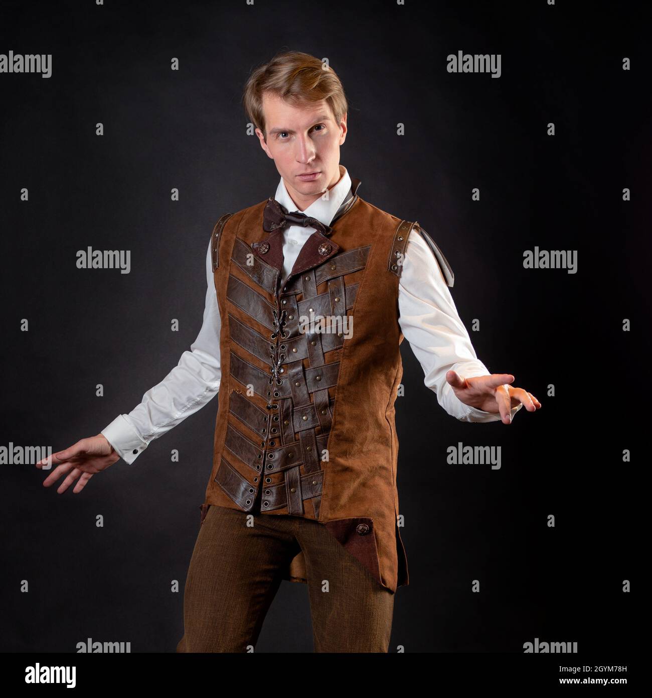 An intelligent gentleman in the Victorian style. a steampunk story  character. Vintage retro suit, young attractive man in a vest and bow tie  Stock Photo - Alamy, image size:1300x1390