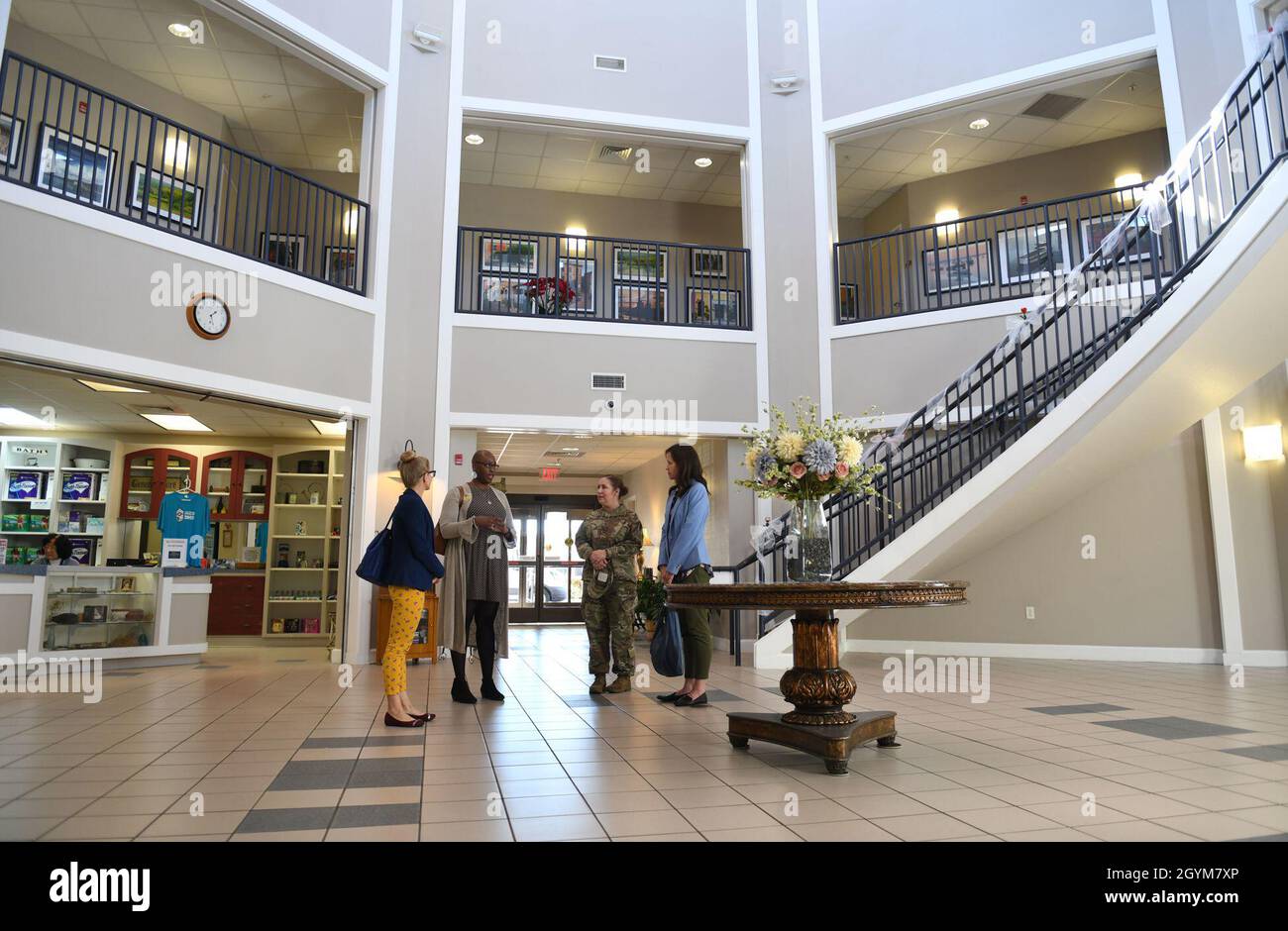 Corvias Military Housing management staff gives a tour to Britt Wills, spouse of Maj. Gen. Craig
