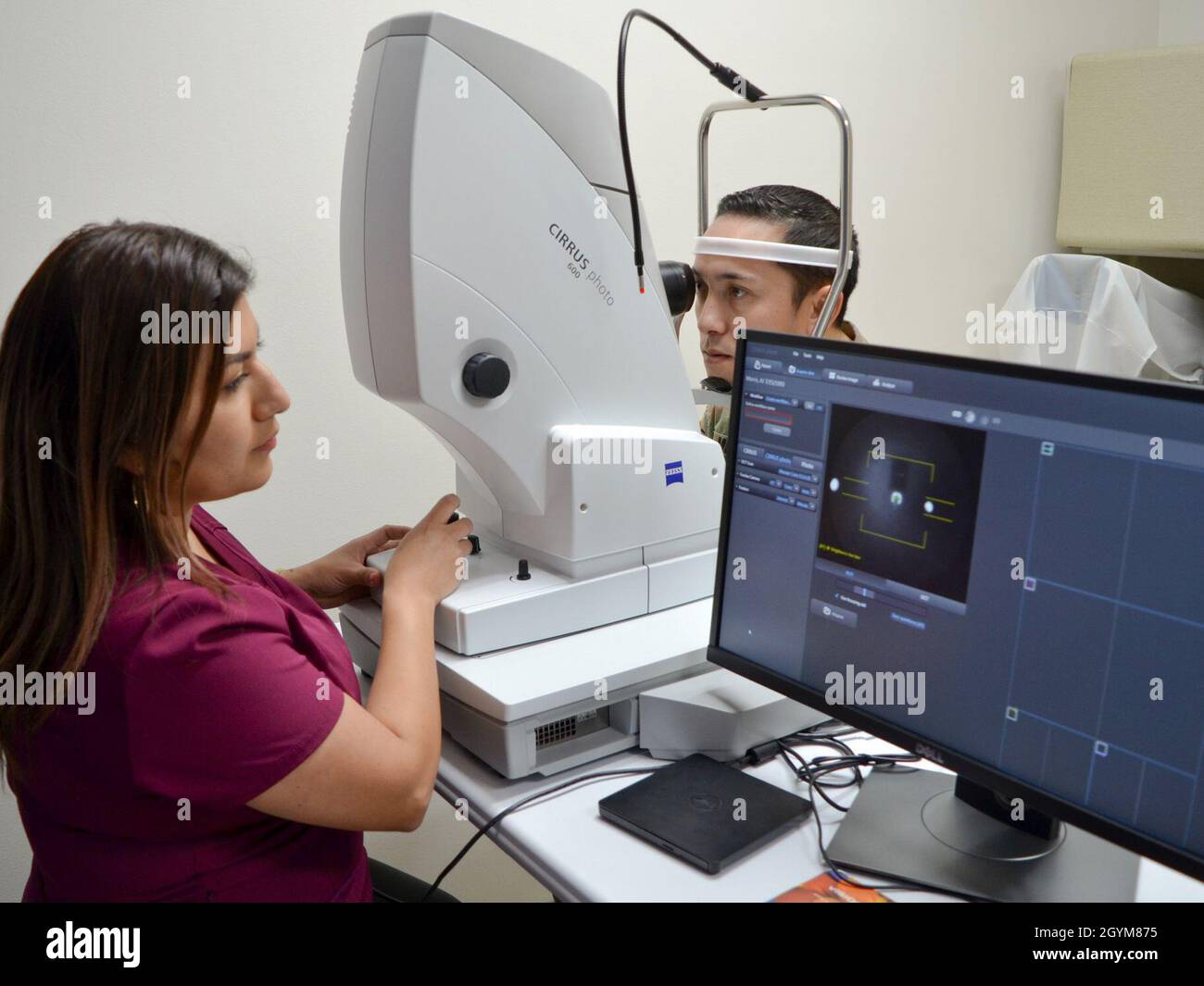 Marisol Emerson, certified optometry assistant, demonstrates how the