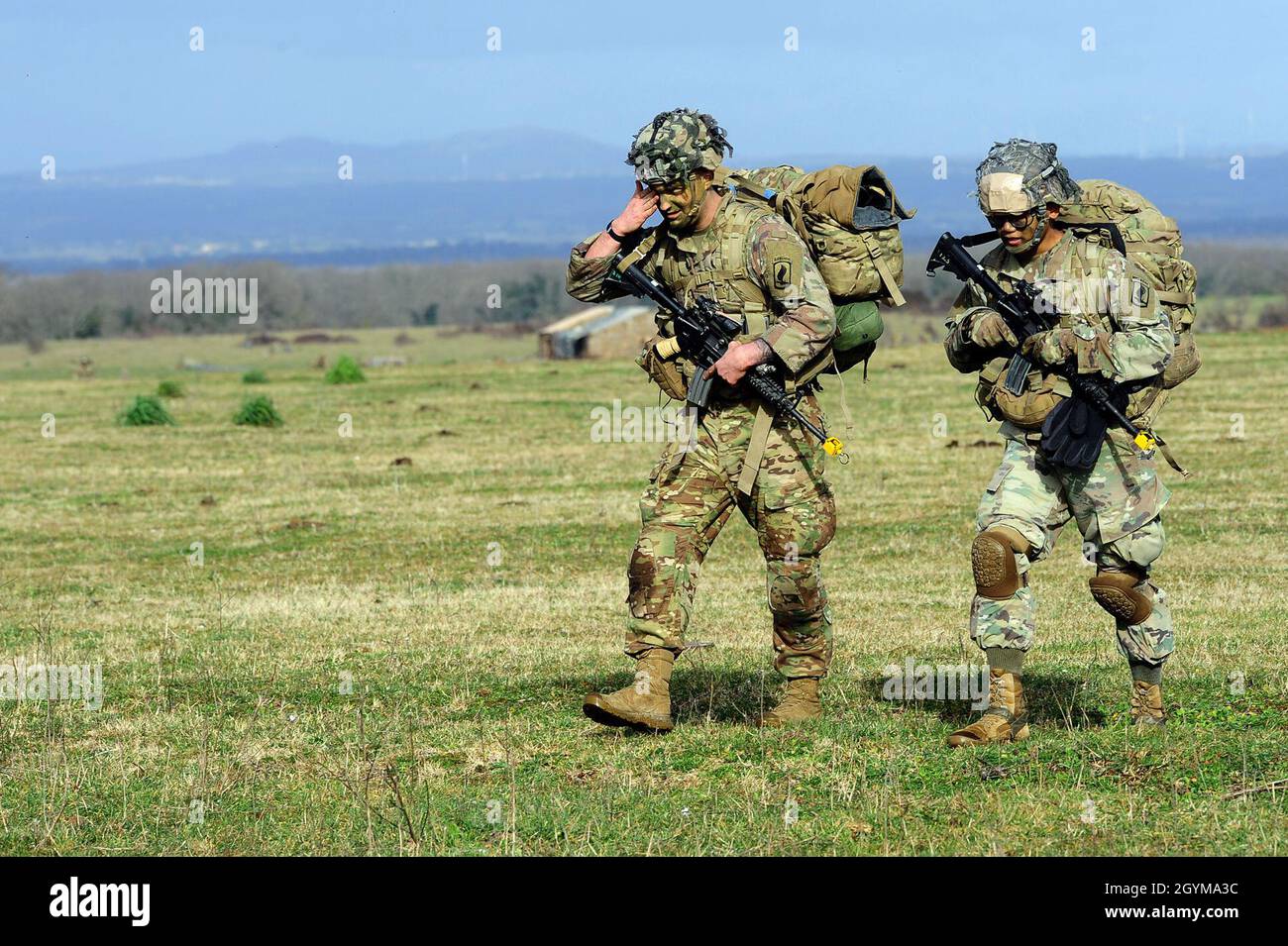U.S. Army paratroopers from HHC, 2nd Battalion, 503rd Infantry Regiment, 173rd Airborne Brigade, move towards the objective during Exercise Rock Topside 20, in Monte Romano, Italy, Jan. 29, 2020. Rock Topside is a joint forced entry exercise to train the battalion’s ability to conduct airborne contingency response force operations. This training stresses the interoperability of both the paratroopers of the 2nd Battalion, 503rd Infantry Regiment and Italian paratroopers of Reggimento Savoia Cavalleria 3.(U.S Army photo by Elena Baladelli) Stock Photo