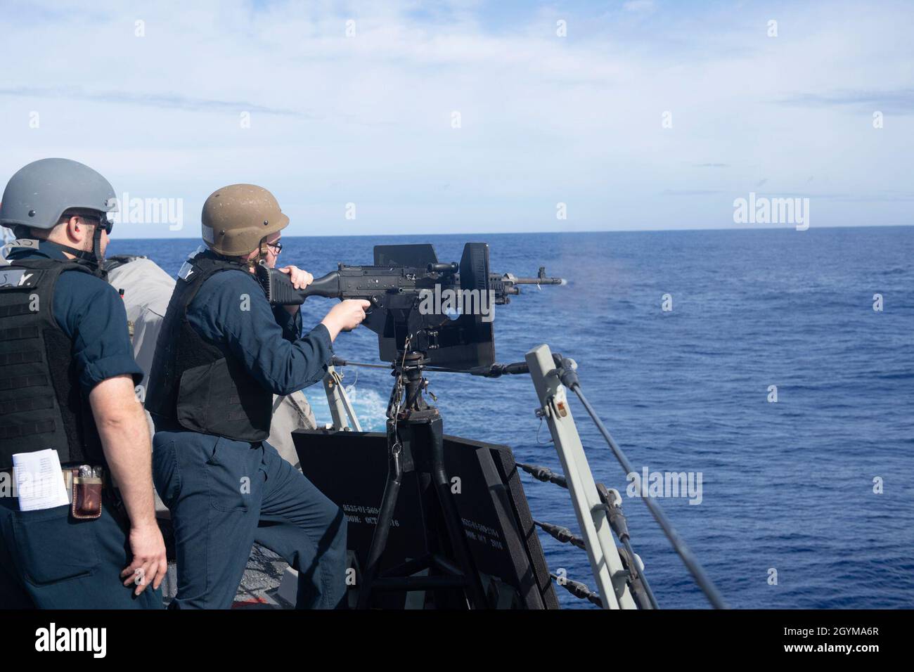 PACIFIC OCEAN (Jan. 29, 2020) Sonar Technician (Surface) 2nd Class Justin Arnold, from Guanacaste, Costa Rica, fires an M240B machine gun aboard the Arleigh Burke-class guided-missile destroyer USS Rafael Peralta (DDG 115) Jan. 29, 2020. Rafael Peralta, part of the Theodore Roosevelt Carrier Strike Group, is on a scheduled deployment to the Indo-Pacific. (U.S. Navy photo by Mass Communication Specialist 2nd Class Jason Isaacs) Stock Photo