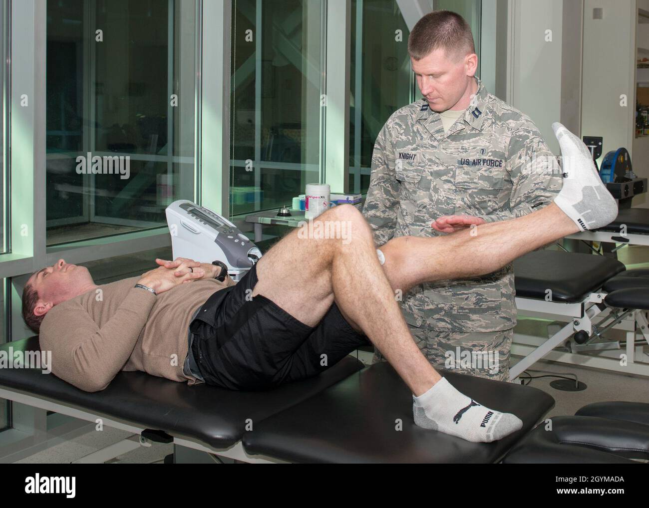 https://c8.alamy.com/comp/2GYMADA/capt-ryan-knight-4th-operational-medical-readiness-squadron-physical-therapist-preforms-neuromuscular-electrical-stimulation-nmes-on-maj-dusten-weathers-334th-flight-squadron-assistant-director-of-operations-jan-29-2019-at-the-thomas-koritz-clinic-on-seymour-johnson-air-force-base-nc-physical-therapist-work-with-patients-to-identify-problems-develop-a-care-plan-and-provide-services-that-help-restore-function-improve-mobility-and-relieve-pain-us-air-force-photo-by-airman-first-class-kimberly-barrera-2GYMADA.jpg