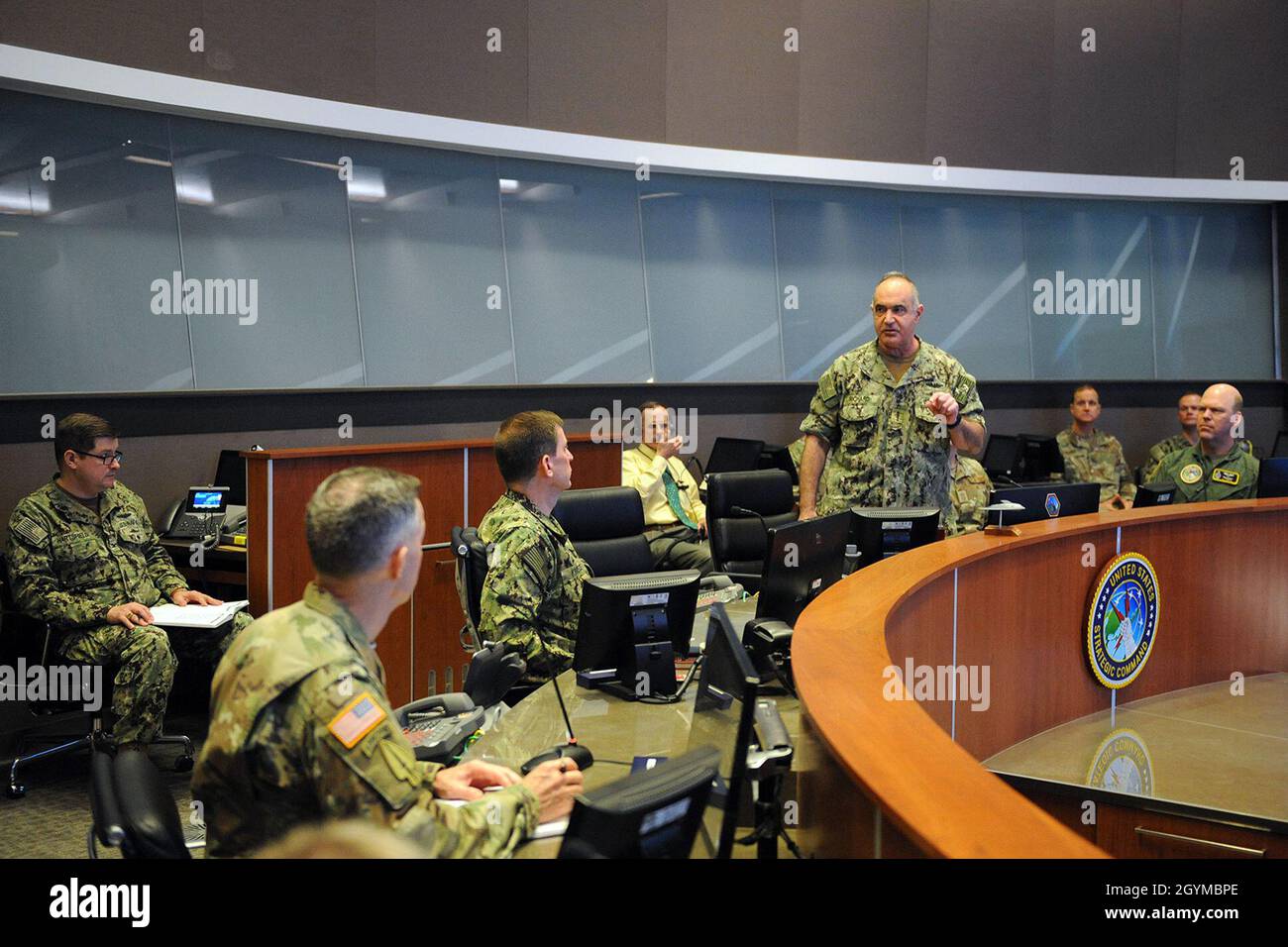 U.S. Navy Adm. Charles “Chas” Richard, commander of U.S. Strategic Command (USSTRATCOM), speaks to his key staff on the battle deck of USSTRATCOM’s command and control facility (C2F) during Exercise Global Lightning 20 at Offutt Air Force Base, Neb., Jan. 30, 2020. Global Lightning 20 tested executing global operations in coordination with the Joint Staff, 5 other combatant commands, services, U.S. government agencies, and allies to deter, detect and, if necessary, defeat strategic attacks against the United States and its allies. This is the first major exercise USSTRATCOM conducted entirely Stock Photo