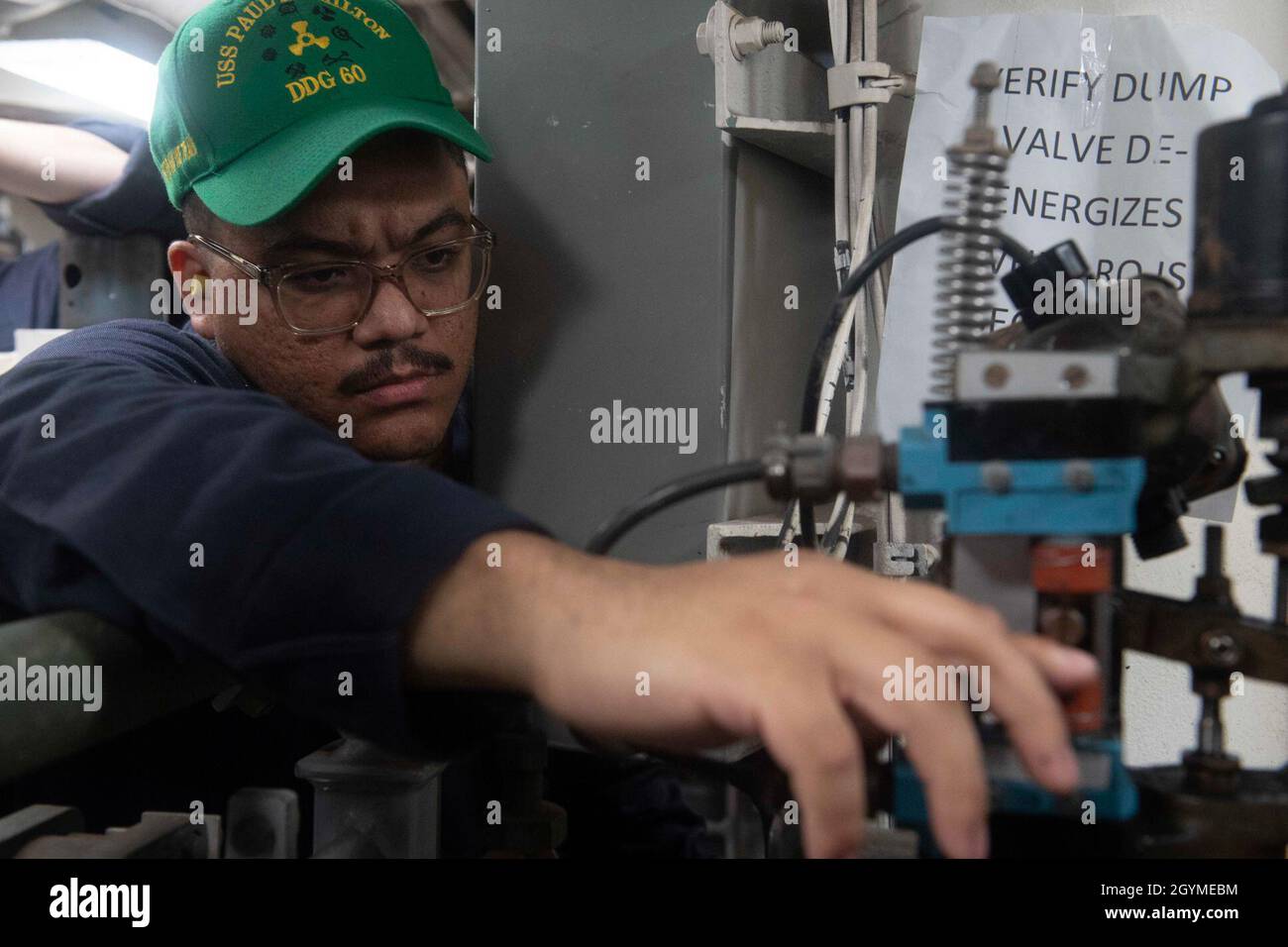 PACIFIC OCEAN (Feb. 1, 2020) U.S. Navy Gas Turbine Systems Technician (Electrical) 2nd Class Victor Rocha, from Tobyhanna, Penn., adjusts a valve aboard the Arleigh Burke-class guided-missile destroyer USS Paul Hamilton (DDG 60) Feb. 1, 2020. Paul Hamilton, part of the Theodore Roosevelt Carrier Strike Group, is on a scheduled deployment to the Indo-Pacific. (U.S. Navy photo by Mass Communication Specialist 3rd Class Matthew F. Jackson) Stock Photo