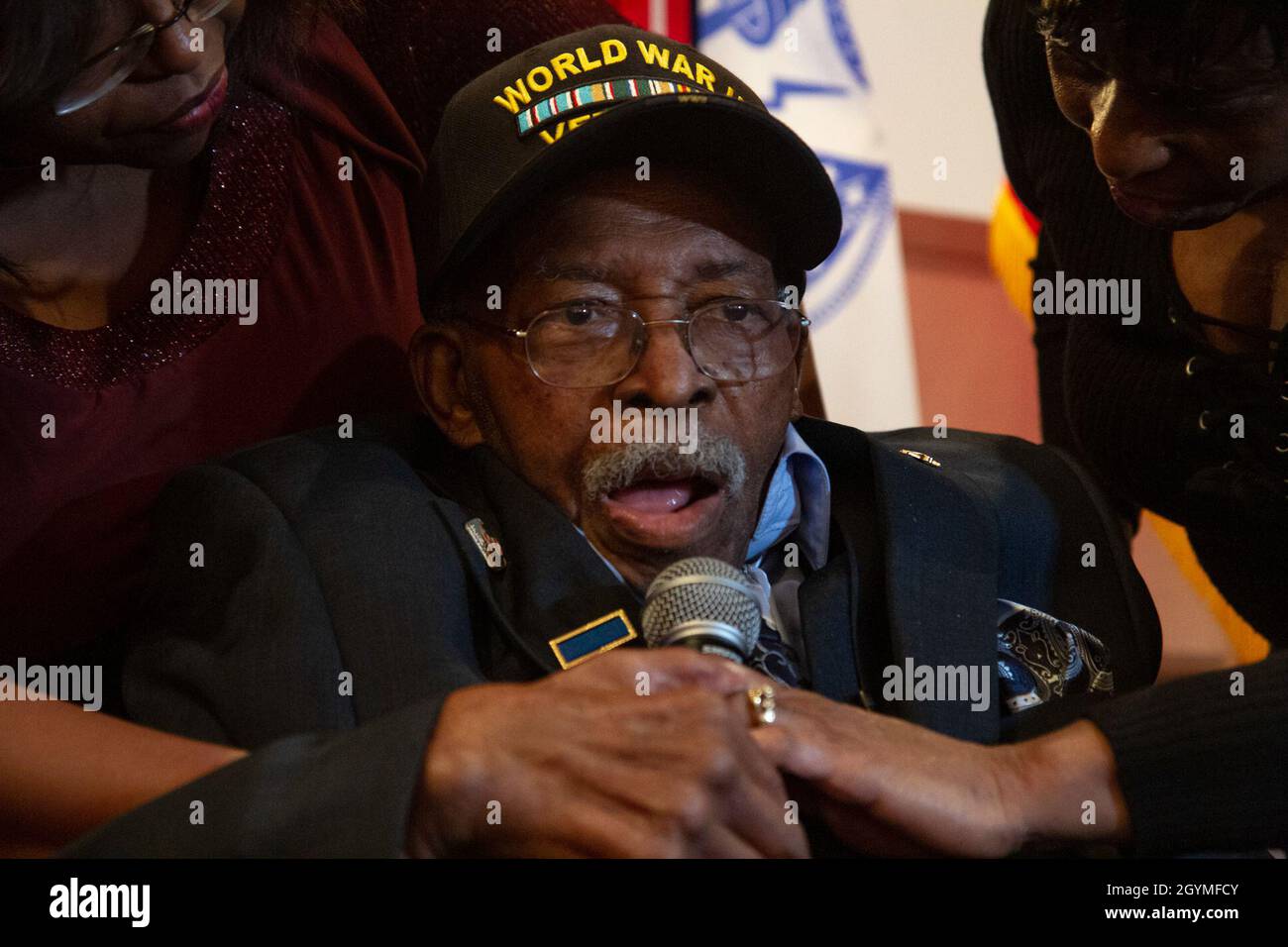 Pvt. Roosevelt Ruffin, a former Army Soldier who served with Company C, 614th Tank Destroyer Battalion, during World War II, addresses those in attendance at his 100th birthday celebration Feb. 1, 2020, in Virginia Beach, Virginia. Ruffin was one of the very first African-American tank destroyer unit members of the war. (U.S. Army Reserve photo by Sgt. 1st Class Javier Orona) Stock Photo