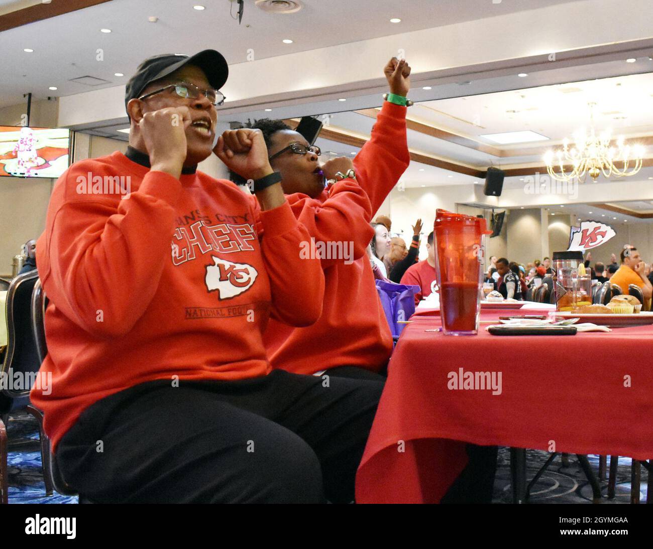 Retired Lt. Col. Douglas Fields, head of the Junior Reserve Officers’ Corps at Zama Middle High School, and his wife Kathy, cheer for the Kansas City Chiefs during the Super Bowl LIV party at the Camp Zama Community Club, Camp Zama, Japan, Feb. 3, 2020. Stock Photo