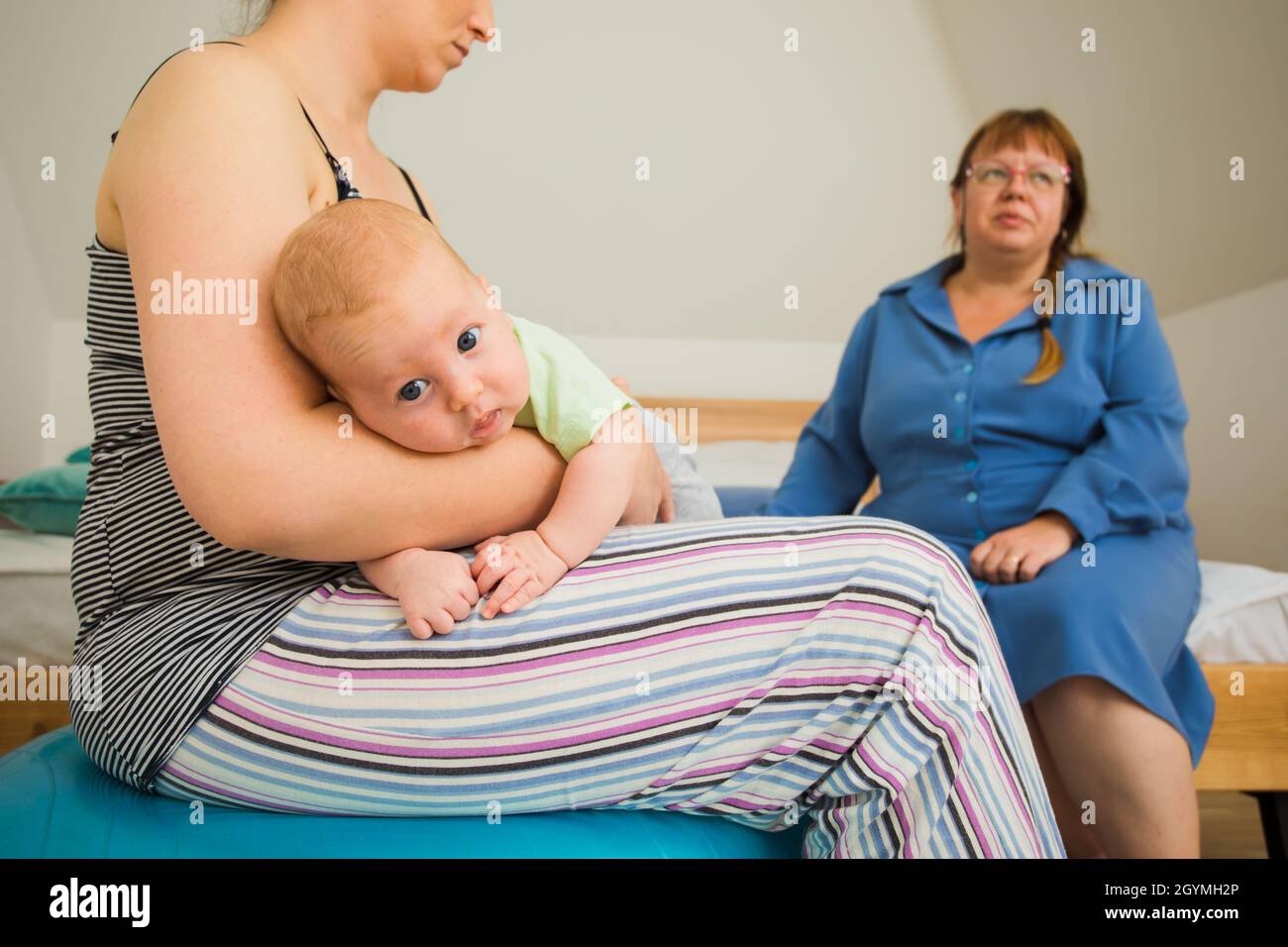 Closeup view newborn baby breastfeeding. Young mother learning how to