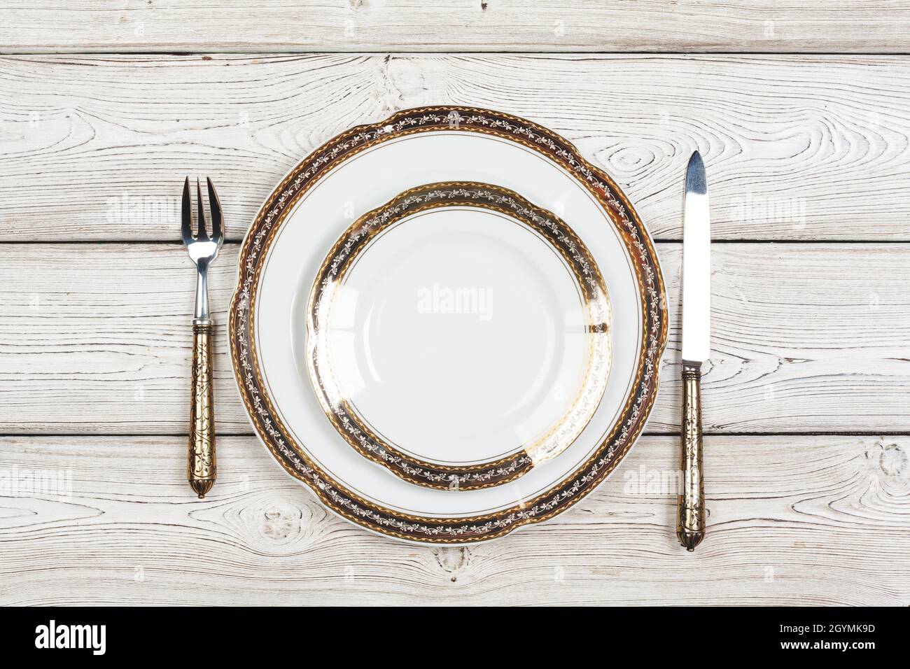 Top view of a beautiful table setting on white wooden background Stock Photo