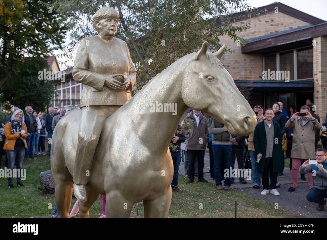 Etsdorf, Germany. 08th Oct, 2021. An equestrian statue of still-Federal Chancellor Angela Merkel after the unveiling. The 2.70-meter-high life-size sculpture was made of lightweight concrete and by means of a corresponding 3D printer. The idea came from the artist Wilhelm Koch, who for decades has been realizing unusual projects such as an air museum with sculptures made from inflated rubber hoses. Credit: Daniel Karmann/dpa/Alamy Live News Stock Photo