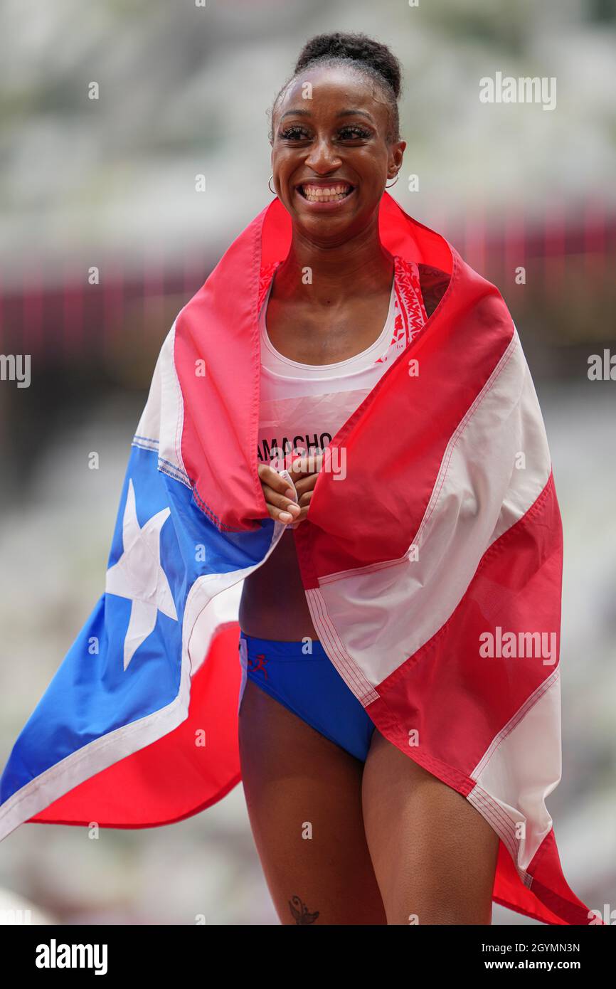 Jasmine CamachoQuinn with her country's flag after winning gold at the