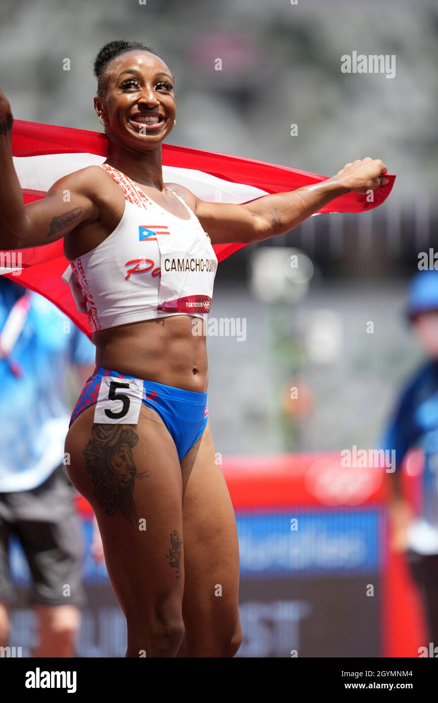 Jasmine CamachoQuinn with her country's flag after winning gold at the
