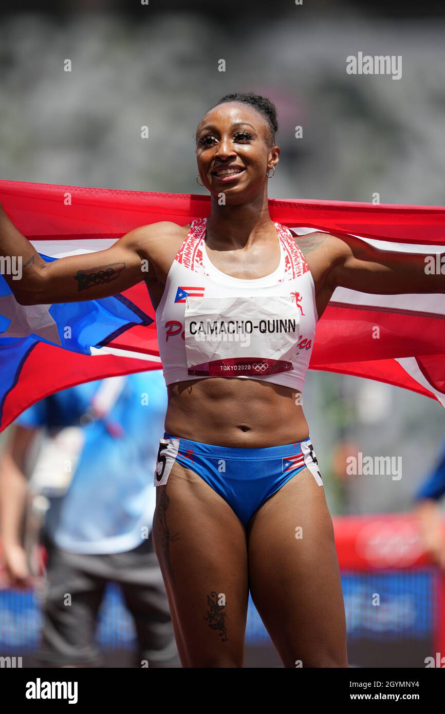 Jasmine CamachoQuinn with her country's flag after winning gold at the