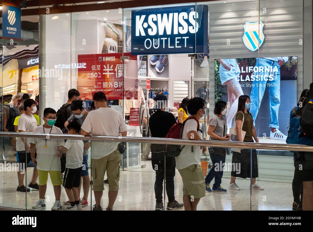 Shoppers are seen in front of the American athletic shoe brand K-Swiss  outlet store in Hong Kong Stock Photo - Alamy