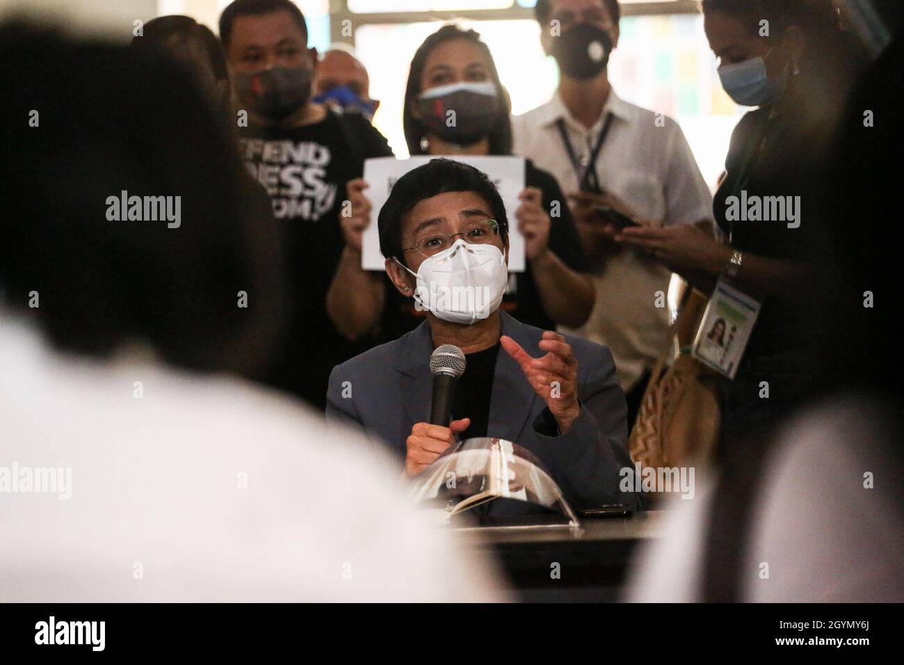 Rappler CEO and Executive Editor, Maria Ressa (center) wearing a protective mask gestures as she attends a media conference after a court hearing at the Manila Regional Trial Court, Philippines on Monday. June 15, 2020. The Manila court found Maria Ressa, her online news outfit Rappler Inc. and former reporter Reynaldo Santos Jr. guilty of cyber libel. Philippines. Stock Photo
