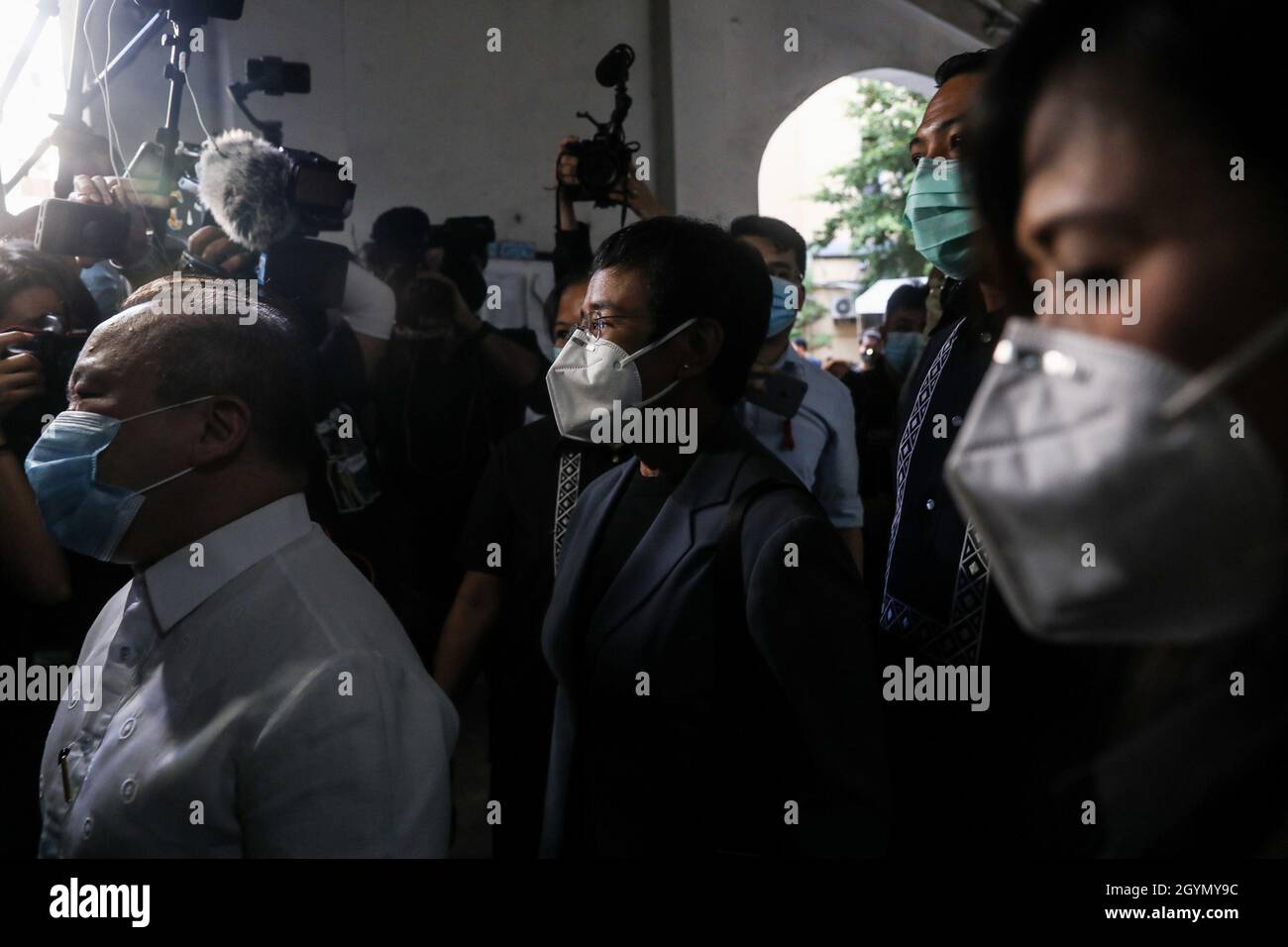 Rappler CEO and Executive Editor, Maria Ressa (center) gestures as she arrives for a court hearing at the Manila Regional Trial Court, Philippines on Monday. June 15, 2020. The Manila court found Maria Ressa, her online news outfit Rappler Inc. and former reporter Reynaldo Santos Jr. guilty of cyber libel. Philippines. Stock Photo
