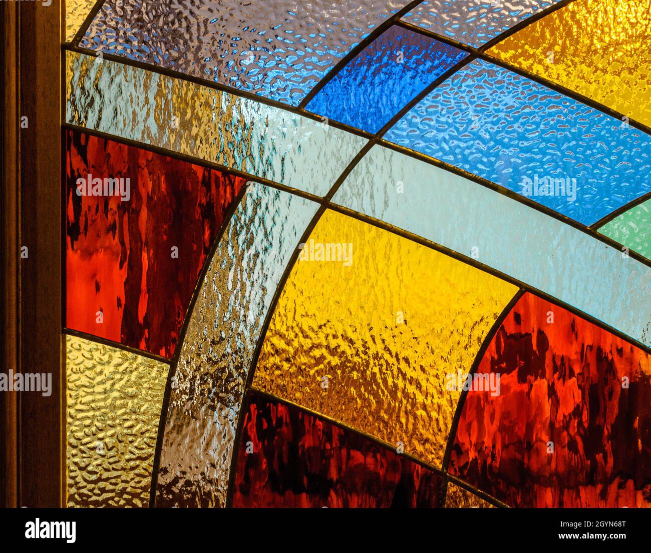 Embossed painted glass with metal separated sections. Geometric shapes with colored glass Stock Photo