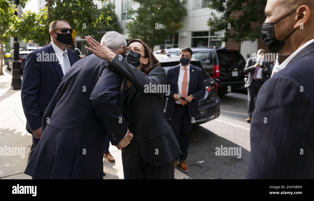Newark, USA. 08th Oct, 2021. U.S. Vice President Kamala Harris (C) hugs New Jersey Governor Phil Murphy (L) while standing with U.S. Senator Cory Booker (R) following an off-the-record stop at the bakery Tonnie's Minis as part of Harris' one-day visit to the state in Newark, New Jersey, on Friday, October 8, 2021. Pool photo by Justin Lane/UPI Credit: UPI/Alamy Live News Stock Photo