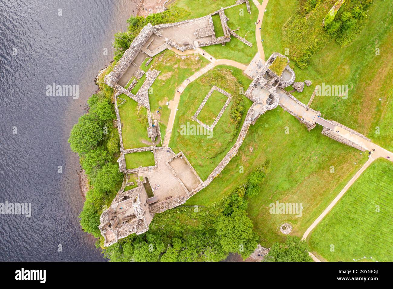 Aerial view Urquhart Castle, a ruin, sits beside Loch Ness in the
