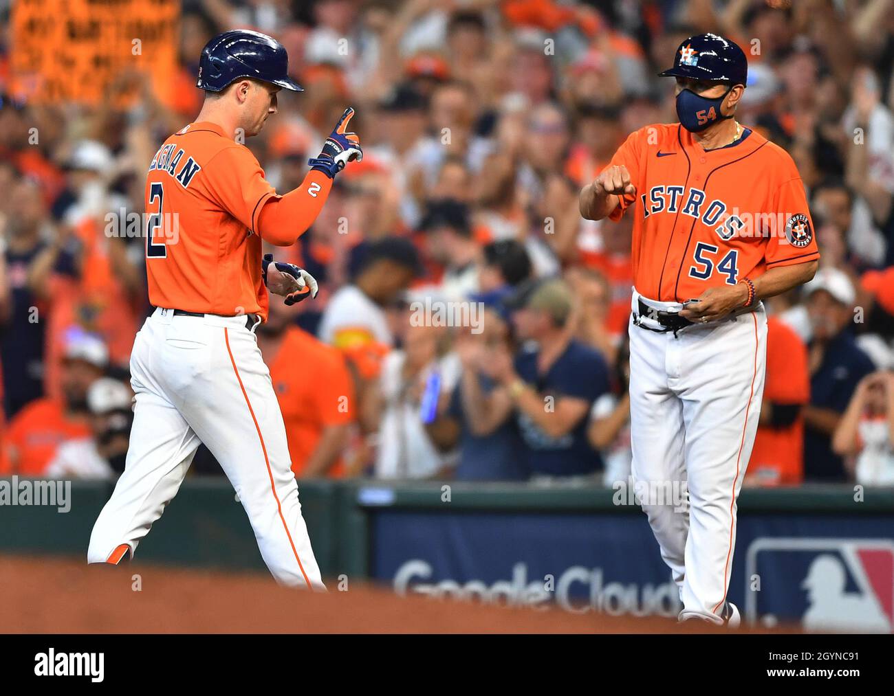 Houston, United States. 26th Oct, 2021. Houston Astros left fielder Michael  Brantley is congratulated by first base coach dan Firova after hitting a  single in the 1st inning of game one against